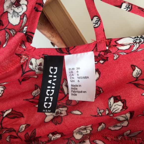 Red Adjustable Romper with White Flowers - Picture 4 of 6